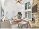 Spacious living room featuring a stone fireplace and vaulted ceilings at 27097 Cove Ln, Tega Cay, SC 29708