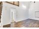 Spacious living room featuring hardwood floors and access to other rooms at 27097 Cove Ln, Tega Cay, SC 29708