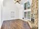 Bright living room with hardwood floors and a stone fireplace at 27097 Cove Ln, Tega Cay, SC 29708