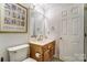 Bathroom with a toilet, vanity, mirror, and towel rack at 2811 Ashley Arbor Dr, Fort Mill, SC 29715