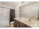 Bathroom featuring a double sink vanity, large mirror, and a shower with a dark shower curtain at 3028 Apple Orchard Pl, Dallas, NC 28034