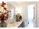 Bathroom with updated vanity and patterned wallpaper at 3474 Lake Wylie Dr, Rock Hill, SC 29732