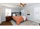 Bedroom with orange bedding and built-in shelving at 3474 Lake Wylie Dr, Rock Hill, SC 29732