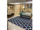 Charming bedroom showcasing fish themed decor, wood paneling, and a blue patterned area rug at 3474 Lake Wylie Dr, Rock Hill, SC 29732
