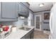 Galley kitchen with granite countertops and gray cabinets at 3474 Lake Wylie Dr, Rock Hill, SC 29732