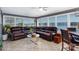 Sunroom with stunning lake views and comfortable seating at 3474 Lake Wylie Dr, Rock Hill, SC 29732