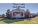 Community clubhouse with a brick facade, manicured landscaping, and inviting entrance at 4026 Saint James Way # 1, Monroe, NC 28110