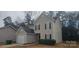 Tan two-story house with attached garage and landscaping at 4225 Parkdale Dr, Charlotte, NC 28208