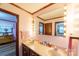 Double vanity bathroom with a large mirror and pink walls at 4816 Zion Church Rd, Concord, NC 28025