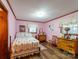 Bedroom with a queen-size bed and wooden dresser at 4816 Zion Church Rd, Concord, NC 28025