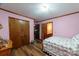 Bedroom with double doors and a view into another room at 4816 Zion Church Rd, Concord, NC 28025