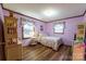 Charming bedroom with floral bedding and wood floors at 4816 Zion Church Rd, Concord, NC 28025