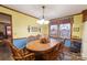 Bright dining area with wood table and chairs, and window views at 4816 Zion Church Rd, Concord, NC 28025