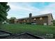 Brick home with a sunroom addition and a spacious backyard at 4816 Zion Church Rd, Concord, NC 28025