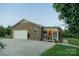 A well-maintained brick home with a two-car garage and a sunroom at 4816 Zion Church Rd, Concord, NC 28025