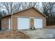 Two-car garage with white doors at 4816 Zion Church Rd, Concord, NC 28025