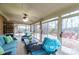 Bright sunroom with comfy seating and view of backyard at 4816 Zion Church Rd, Concord, NC 28025