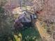 An aerial perspective showcases lush backyard and a back patio at 4833 Addison Dr, Charlotte, NC 28211