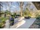 Backyard with dining and sitting areas, a grill, and a hammock at 4833 Addison Dr, Charlotte, NC 28211