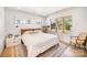 Serene bedroom featuring natural light, a cozy bed, and stylish decor for a restful retreat at 4833 Addison Dr, Charlotte, NC 28211