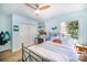 Comfortable bedroom with hardwood floors, a ceiling fan, a window, and a closet at 4833 Addison Dr, Charlotte, NC 28211