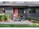 Charming front entrance featuring a pink door, well-manicured landscaping, and a inviting walkway at 4833 Addison Dr, Charlotte, NC 28211