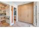 Hallway features a large storage cabinet and a view into the walk-in pantry and powder room at 4833 Addison Dr, Charlotte, NC 28211