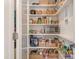 Walk-in pantry with ample shelving and storage space for kitchen essentials and small appliances at 4833 Addison Dr, Charlotte, NC 28211