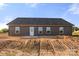 Exterior rear view of a single-Gathering home showing the back door at 5177 Flay Rd, Lincolnton, NC 28021