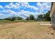 A spacious backyard offers ample room for outdoor activities and overlooks neighboring homes surrounded by mature trees at 5177 Flay Rd, Lincolnton, NC 28021
