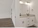 Bright bathroom featuring granite countertops, dual sinks, and sleek black hardware at 5177 Flay Rd, Lincolnton, NC 28021