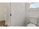 Cozy bathroom showcasing a window, toilet, and a toilet paper holder at 5177 Flay Rd, Lincolnton, NC 28021
