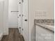 Well-lit bathroom featuring granite countertops, modern black hardware, and a shower at 5177 Flay Rd, Lincolnton, NC 28021