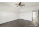 Bedroom featuring dark wood-look floors, white walls, doors, trim, and a modern ceiling fan at 5177 Flay Rd, Lincolnton, NC 28021