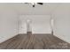 Large primary bedroom featuring neutral walls, a ceiling fan, and modern wood-look flooring at 5177 Flay Rd, Lincolnton, NC 28021