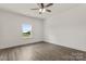 Bright bedroom with ceiling fan, and luxury vinyl plank flooring, with window at 5177 Flay Rd, Lincolnton, NC 28021