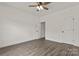 Spacious bedroom featuring neutral walls, a ceiling fan, and modern wood-look flooring at 5177 Flay Rd, Lincolnton, NC 28021