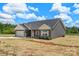 Charming single-story home with gray siding, a two-car garage, and a well-manicured lawn at 5177 Flay Rd, Lincolnton, NC 28021