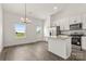 Bright kitchen has granite counters, stainless appliances, and adjacent dining area at 5177 Flay Rd, Lincolnton, NC 28021