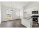 Bright kitchen with white cabinets, stainless appliances, and eat-in area at 5177 Flay Rd, Lincolnton, NC 28021