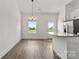 Eat in kitchen featuring modern stainless steel appliances, granite countertops, hardwood floors, lots of cabinet space, and views at 5177 Flay Rd, Lincolnton, NC 28021