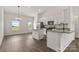 Bright and airy kitchen with modern stainless steel appliances, granite countertops, hardwood floors, and lots of cabinet space at 5177 Flay Rd, Lincolnton, NC 28021