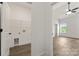 View from bedroom to a laundry room complete with washer and dryer hookups at 5177 Flay Rd, Lincolnton, NC 28021