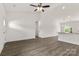 Spacious living room featuring hardwood floors, high ceilings, recessed lights, and large windows offering scenic views of the outdoors at 5177 Flay Rd, Lincolnton, NC 28021