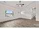 Bright living room with high ceilings, wood-look flooring, and a large window at 5177 Flay Rd, Lincolnton, NC 28021
