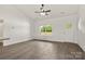 Inviting living room features hardwood floors, natural light streaming through the windows, and a welcoming entry door at 5177 Flay Rd, Lincolnton, NC 28021
