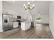 Open floor plan: kitchen with stainless appliances flows into the spacious living area at 5177 Flay Rd, Lincolnton, NC 28021