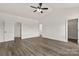 Spacious main bedroom featuring neutral walls, a ceiling fan, and modern wood-look flooring at 5177 Flay Rd, Lincolnton, NC 28021
