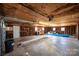 Unfinished garage interior with concrete floor and overhead lighting at 5513 Suttlemyre Ln, Hickory, NC 28601