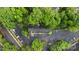 Aerial view of the property displaying ample parking, verdant landscaping, and a well-maintained exterior at 5929 Quail Hollow Rd # B, Charlotte, NC 28210
